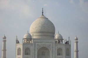 A stunning view of the Taj Mahal's marble dome showcasing Mughal architecture in Agra, India.
