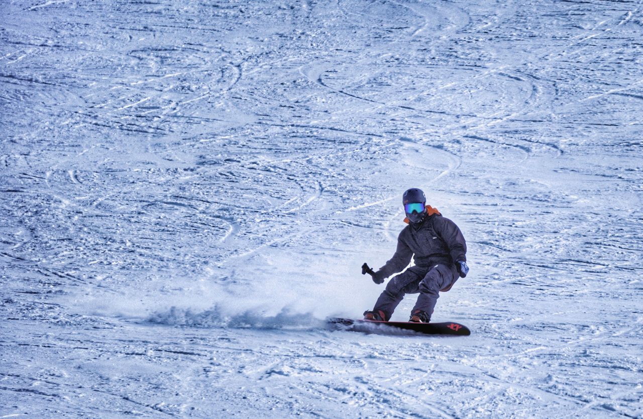Capturing the thrill of skiing on snowy slopes in Zhangjiakou, China during winter.